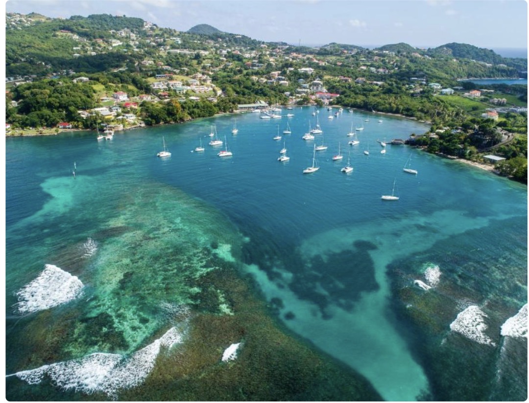 Caribbean harbor with turquoise water and sailboats