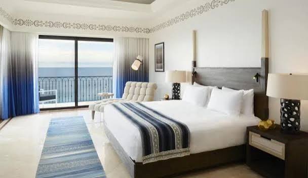 Ocean-view hotel room with a private balcony