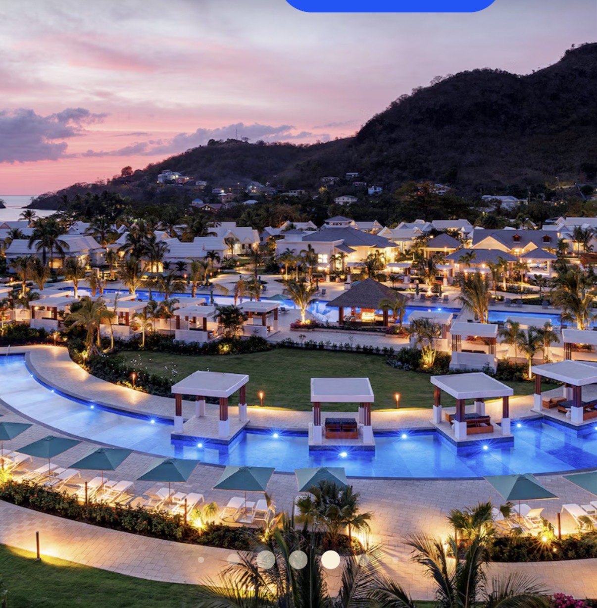 Resort pools and hillside at sunset